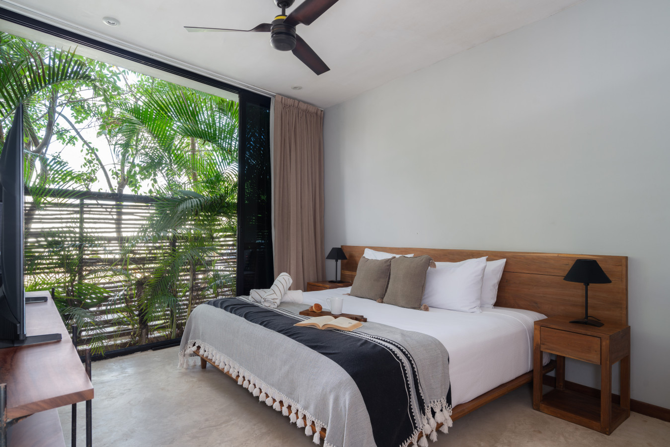 This tranquil bedroom offers a plush king bed, soothing daylight, and beautiful garden views—perfect for rest and renewal.
