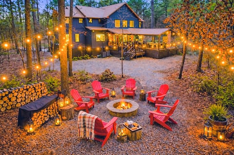 Cozy firepit nights under the string lights — guest favorite!