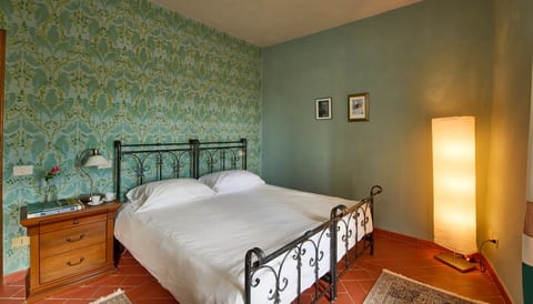 Relaxing and inviting main bedroom with hand painted wall mural, window view, new mattresses and excellent ensuite bathroom