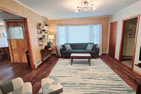 Spacious living room. Couch sleeps 1 in a pinch - 80" total length.