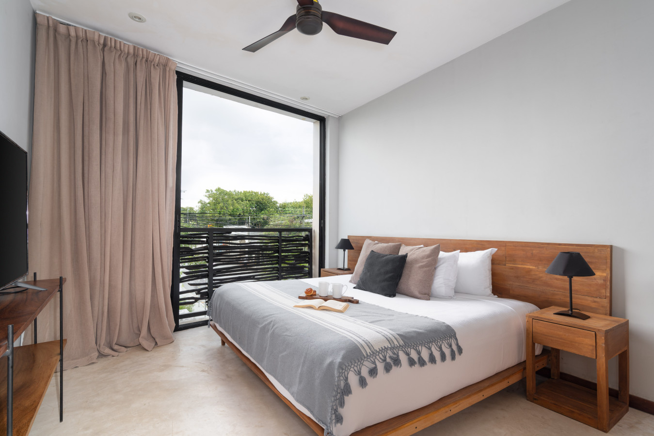 This inviting room features a luxurious king bed, large windows with gorgeous views, and plenty of sunlight. Designed for comfort and relaxation, it’s the perfect retreat to rest and recharge.