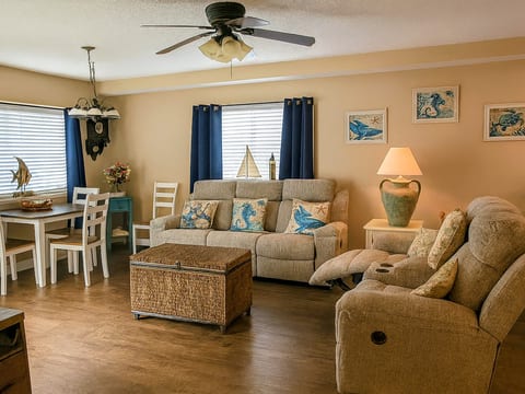 Cozy coastal living room with dining nook and plenty of natural light