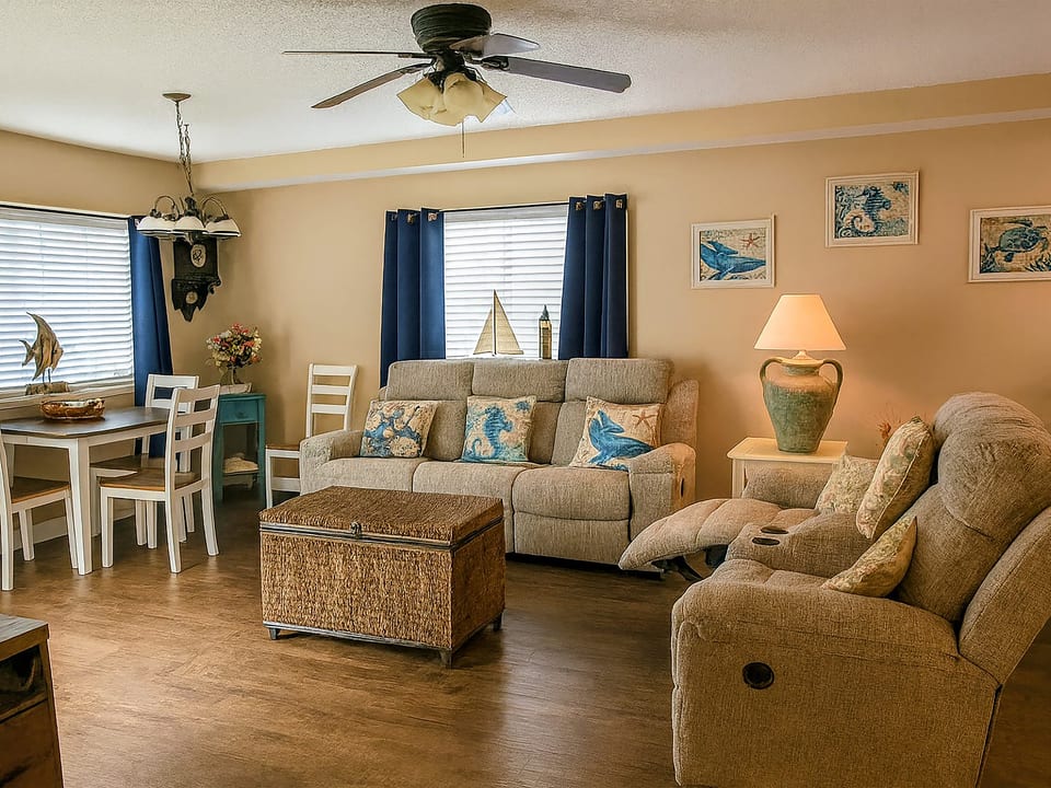Cozy coastal living room with dining nook and plenty of natural light