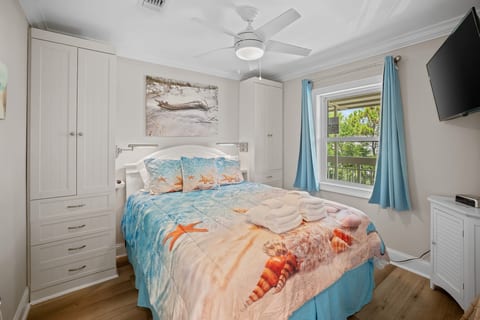 Bedroom with Built ins and reading lights at head of Bed w USB chargers, roku smart tv