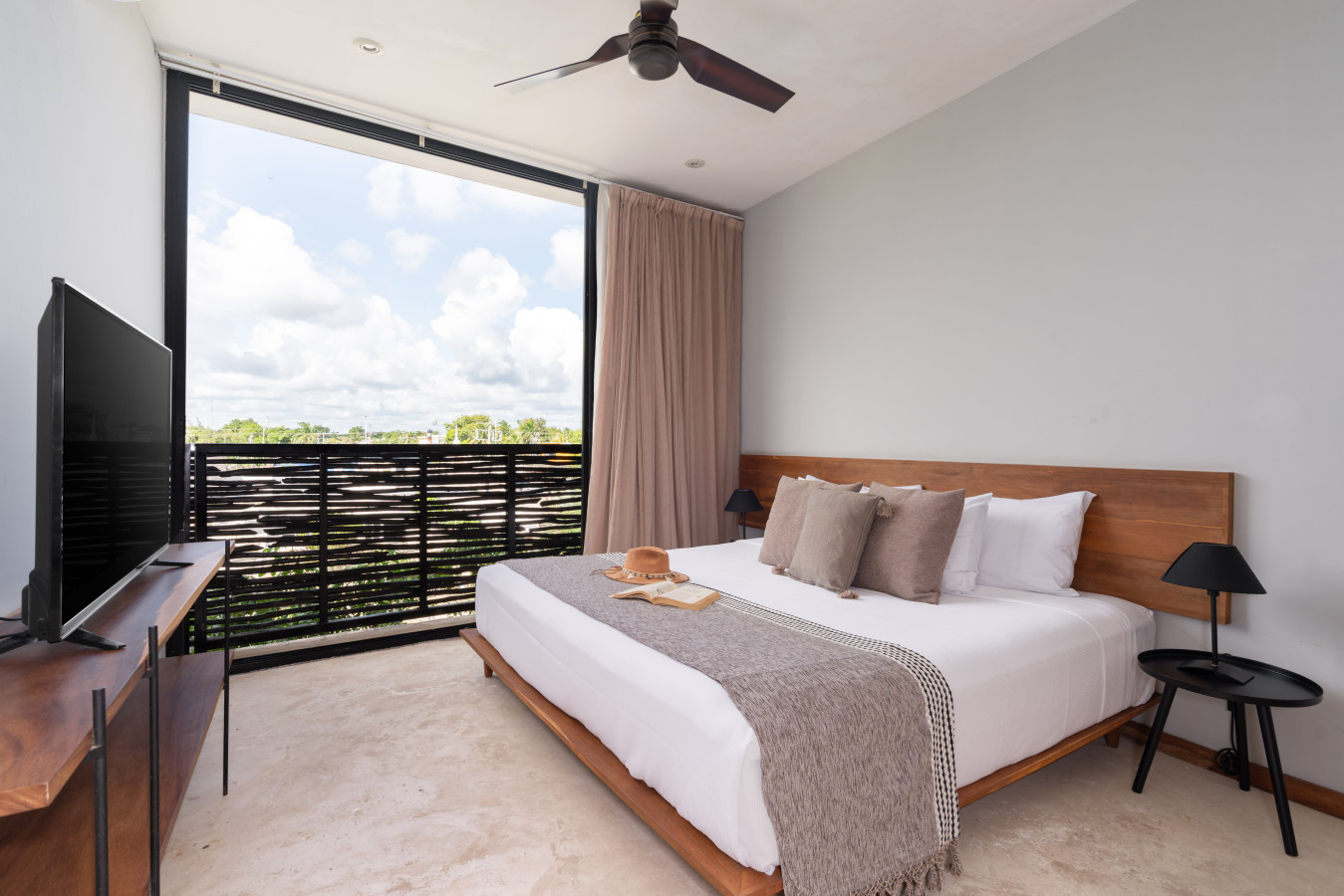 Enjoy a cozy king bed, sunlit space, and cool air conditioning in this inviting studio designed for comfort and ease.