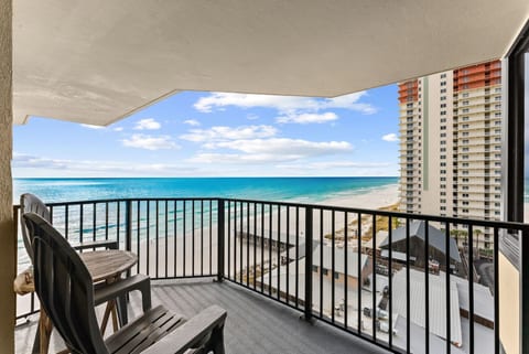 Private balcony views overlooking the white sandy beach and emerald Gulf waters—paradise right outside your door.