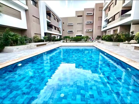 Sunny Beachside Apartment with Pool and Parking