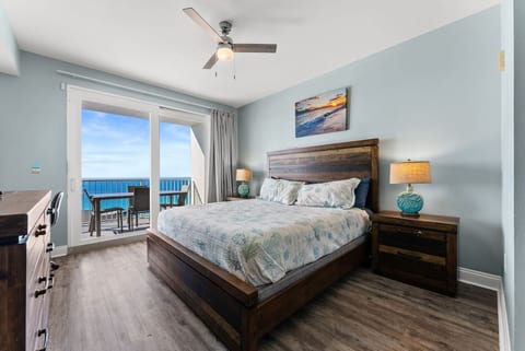 King bedroom with direct balcony access and breathtaking Gulf views right from your bed.