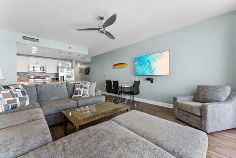 Cozy lounge setup with oversized sectional seating perfect for family movie nights after a day at the beach.