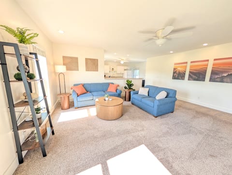 Spacious living room in the upstairs apartment, couch pulls out to queen sized sleeper.