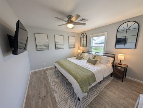 Bedroom #1 with a king sized bed and Helix mattress - your ultimate spot for relaxation after a long day of adventure.