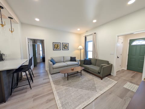 Relax in our cozy living room with Roku Smart TV in guest mode and pullout couch