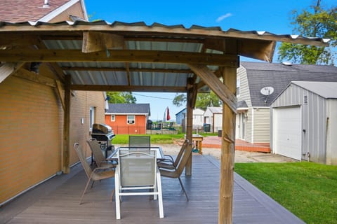 Peek-A-Book views of Lake Erie from the back deck complete with a fish cleaning station, grill and outdoor seating to enjoy a meal.