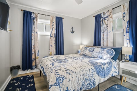 Bedroom #1 with queen bed and smart TV ready to relax.