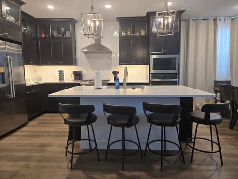 Eat-in kitchen with any gourmet chef will enjoy cooking in along with the huge island and dining table.