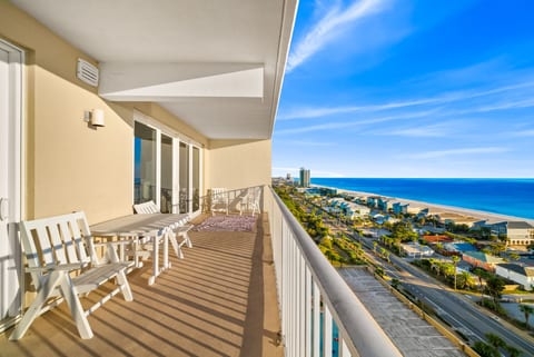 Expansive wraparound-style balcony overlooking miles of emerald coastline