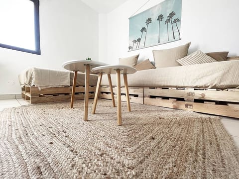 Living room: View to the hand made palette sofa (with comfy real mattresses)
