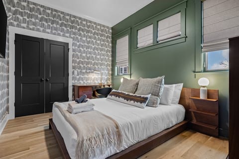 A calm, hotel-level sleeping space designed for deep rest and unrushed mornings.