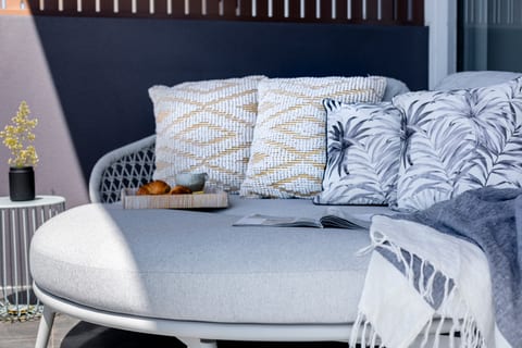 Dreamy daybed!  Located on the balcony off the master bedroom, with amazing views over the town and out to the ocean