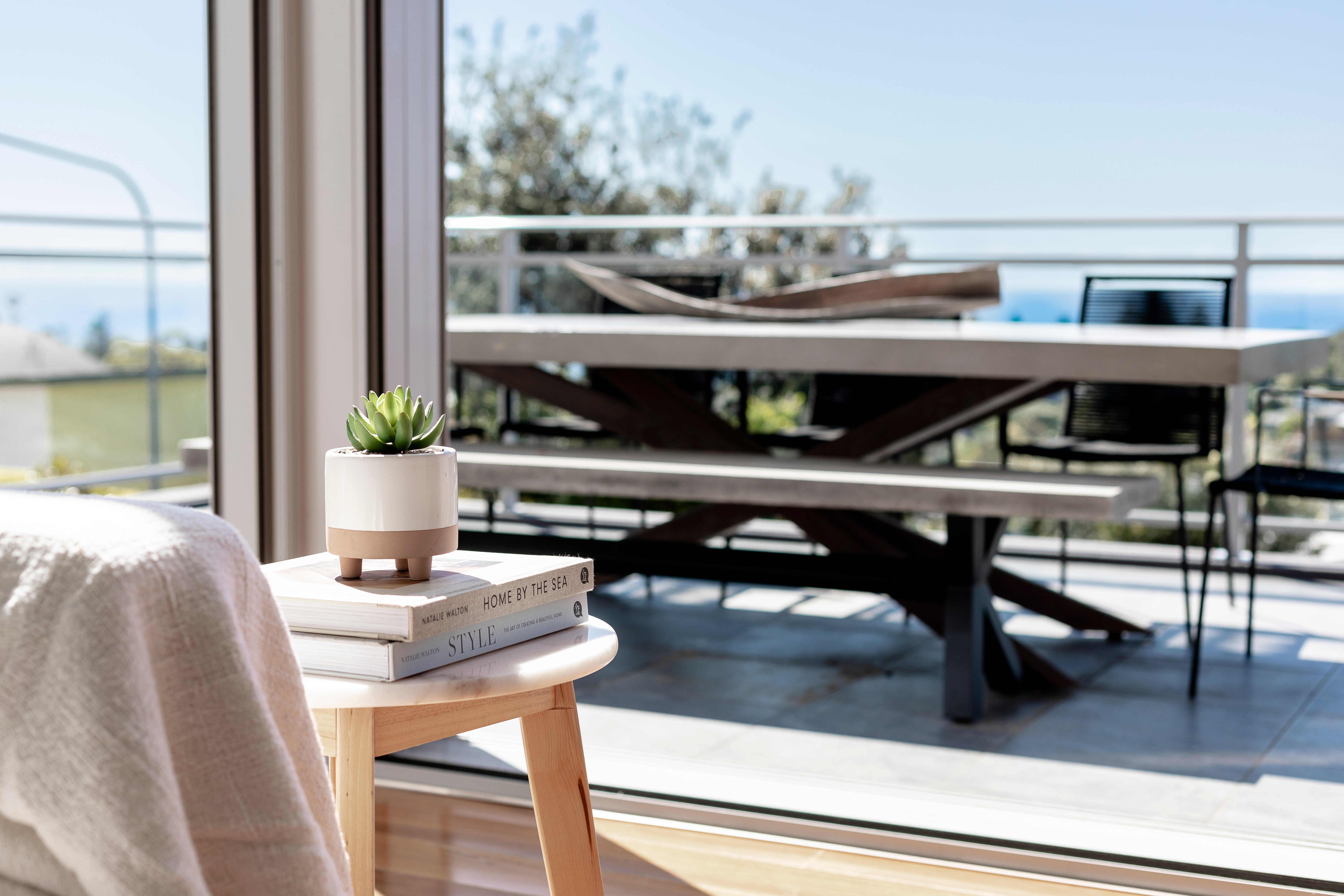 Outdoor dining setting for 8.  Beautiful concrete table with lovely designer chairs.  Ocean views