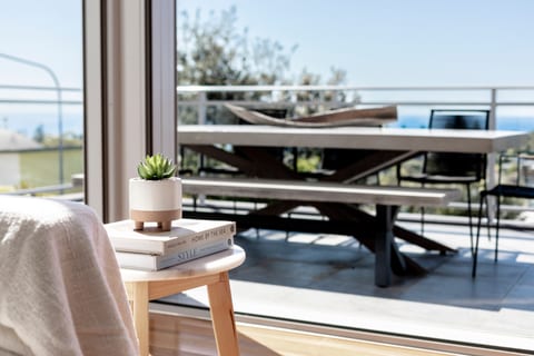 Outdoor dining setting for 8. Beautiful concrete table with lovely designer chairs. Ocean views