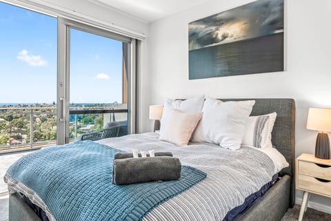 Master bedroom with generous balcony and daybed. Full builtins and ensuite behind