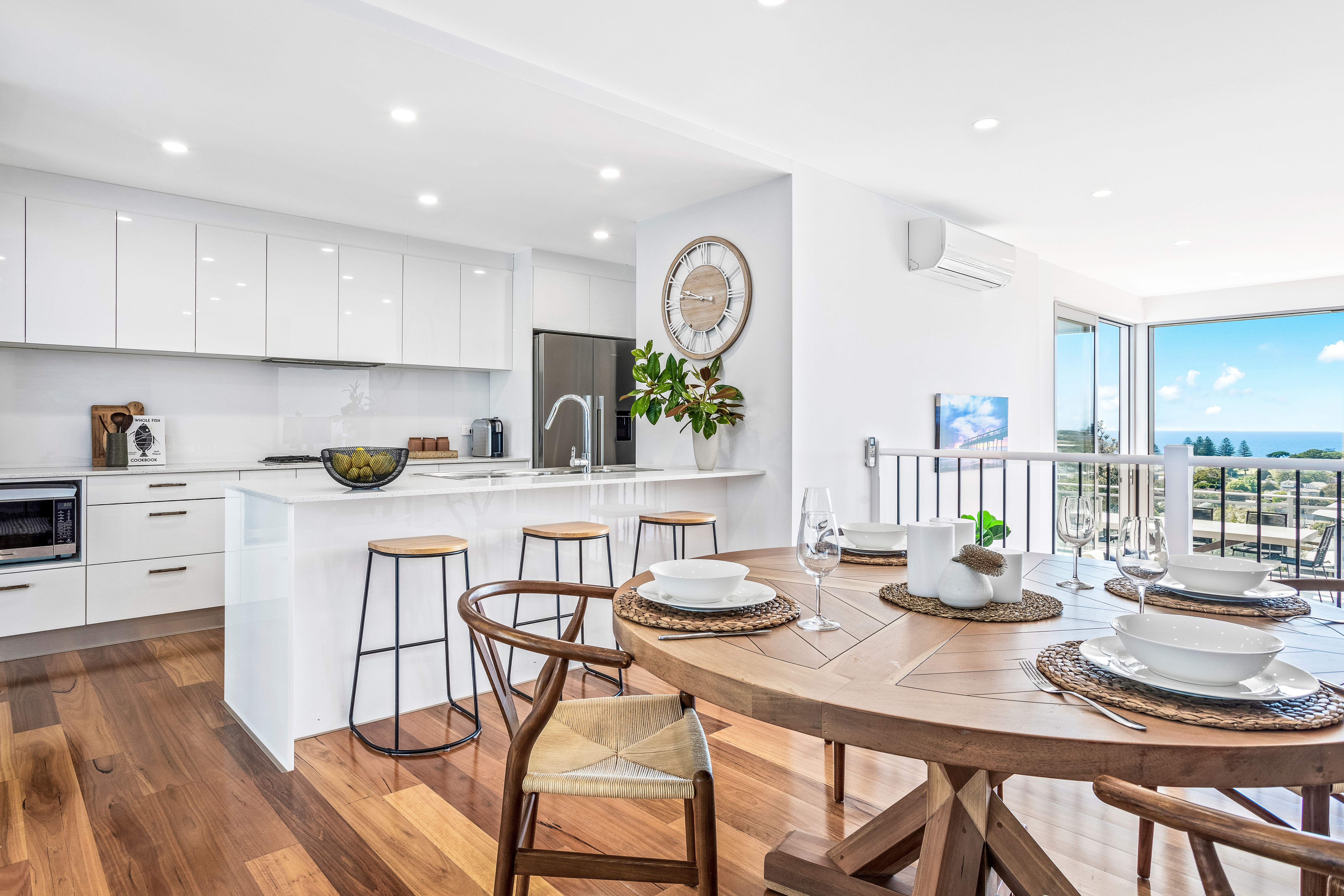 Dining room through to living room and off to the balcony and ocean views
