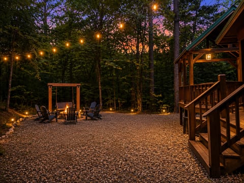 Firepit off the back deck with swing and laid back seating