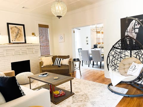 Living room looking into the dining room/kitchen. Who wants a swing in our egg chair?!