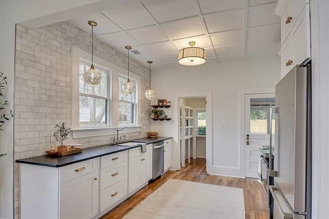 Bright and airy kitchen with every amenity for your convenience! Beautiful leathered granite countertops, stainless appliances and everything that you'll need to cook up something fabulous while you stay with us.