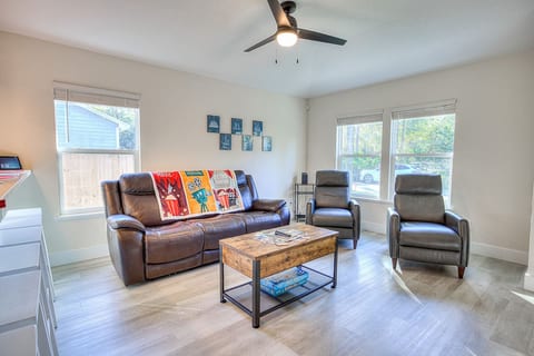 Livingroom with power recliner couch (head and footrest), expanding table, and reclining leather chairs.