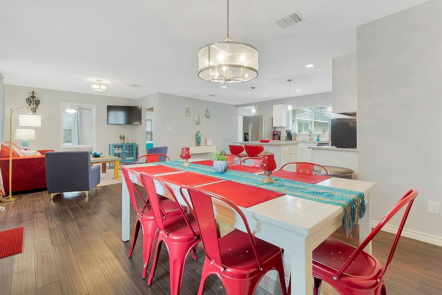 Open layout including kitchen table with seating for 8, plus a high chair