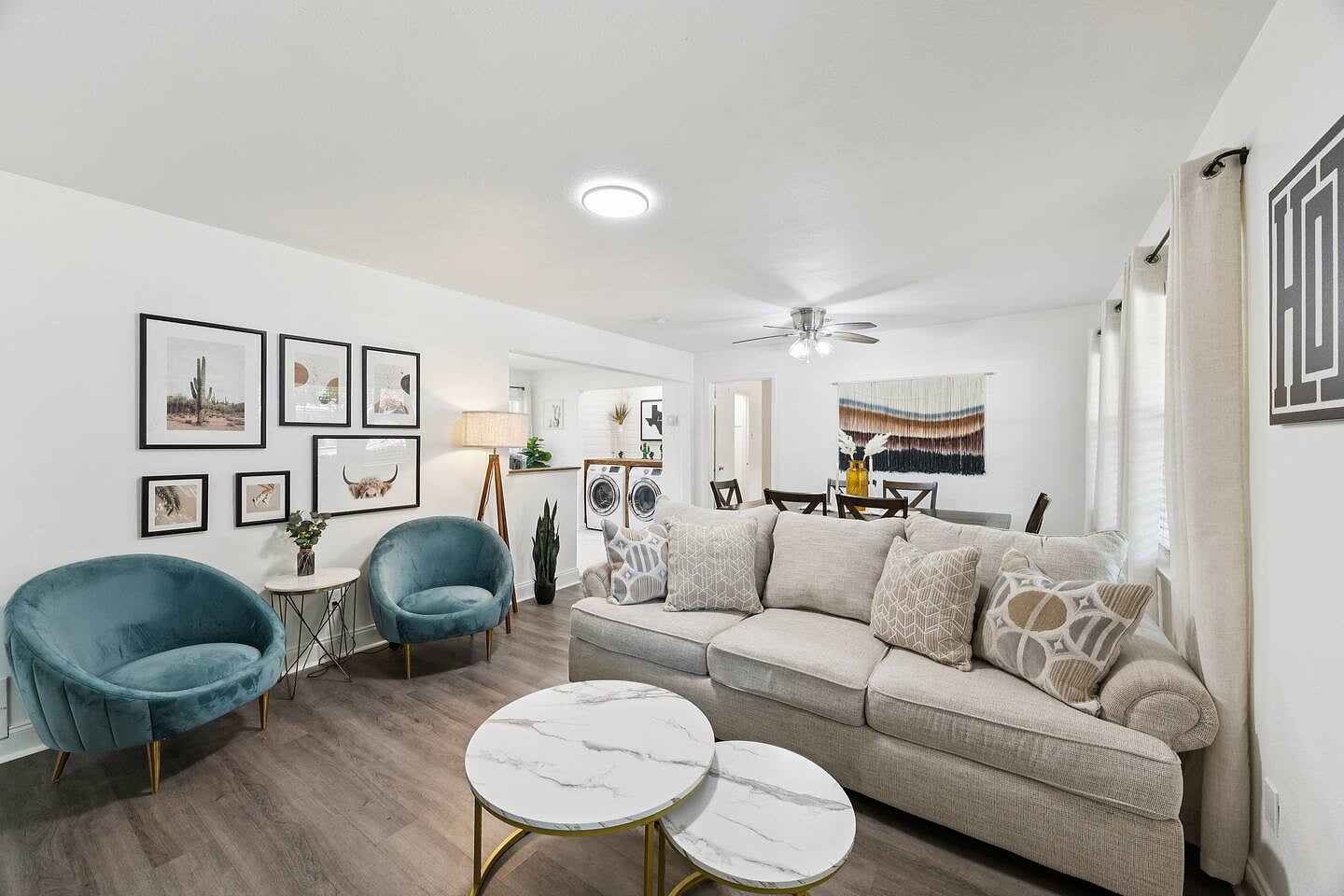 Bright and welcoming living room with comfy seating, modern decor, and plenty of natural light. A perfect space for movie nights, work time, or relaxing after a day exploring Dallas Fort Worth.