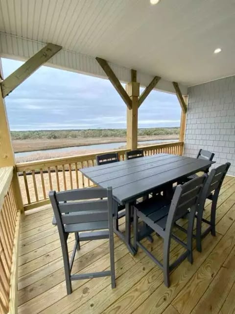 View from the 2nd story deck that takes in the expansive view of Waters Bay and the evening sunset. Seating for 6 to enjoy those views over a meal or drinks.