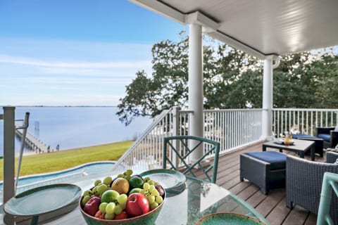 The covered patio with dining off the living room is a respite from the sun.