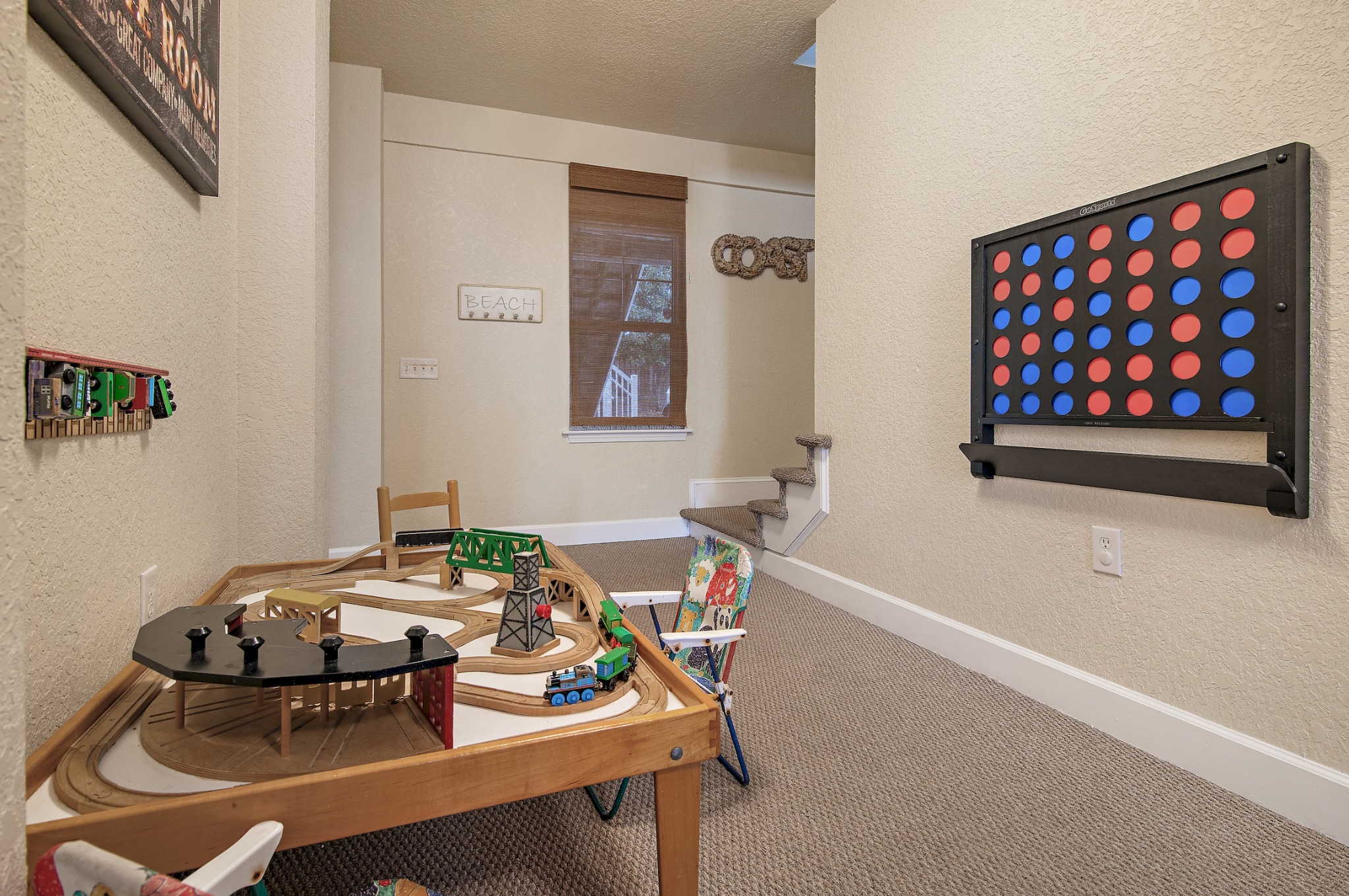 Little guys and gals will enjoy the train table with trains and Connect 4. - The Seahorse Retreat - Navarre