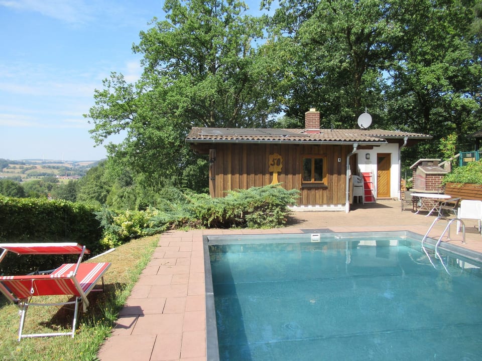 Ferienhäuser mit Pool en emplacement calme au bord de la forêt - Niederaula