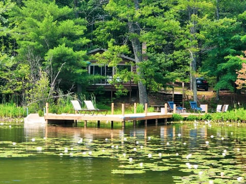 “A secluded lakeside sanctuary made for two. Wake to the shimmer of sunlight on the water, linger together on your private dock & sink into loungers surrounded by whispering pines. This is your own intimate hideaway—quiet, peaceful & entirely yours.”