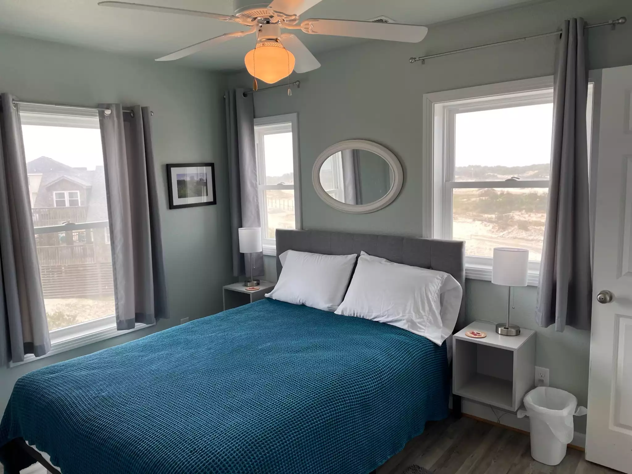 Queen Dune bedroom, has it's own private bath. Views of ocean while sitting in bed. The mirror over the bed catches a view of the ocean, depending on your angle.