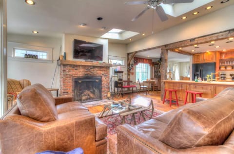 Enjoy a crackling fire in our living room and open kitchen