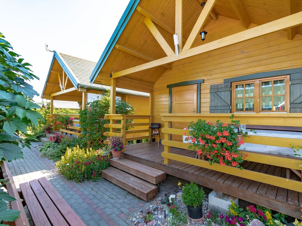 Gemütliches Holzferienhaus mit Grill und Garten - Rusinowo