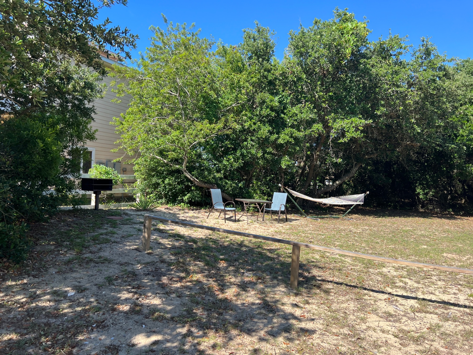 Outdoor charcoal grill and hammock