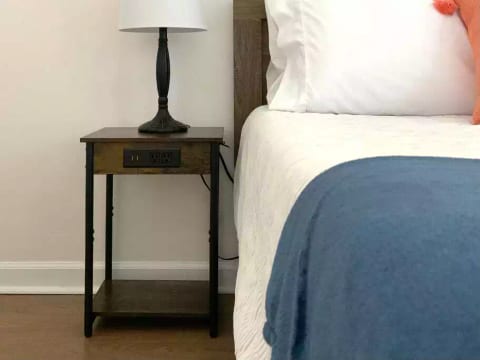 Each bedroom features a table with power and USB ports for charging your phones and devices.