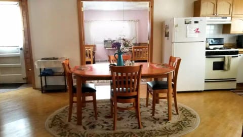 Dining and kitchen area, view to bedroom 1