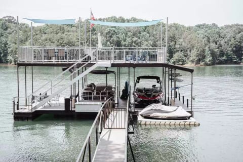 Large dock over deep water. Table that seats 6 upstairs for dining and table for 4 downstairs. Kick back in the Adirondack chairs and watch the beautiful view of the lake. Also fabulous sunset view!