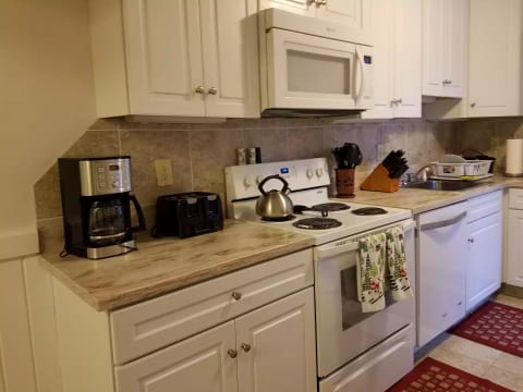 Newly renovated kitchen stocked with lots of dishes, cookware and glasses. New 14 cup coffeemaker!