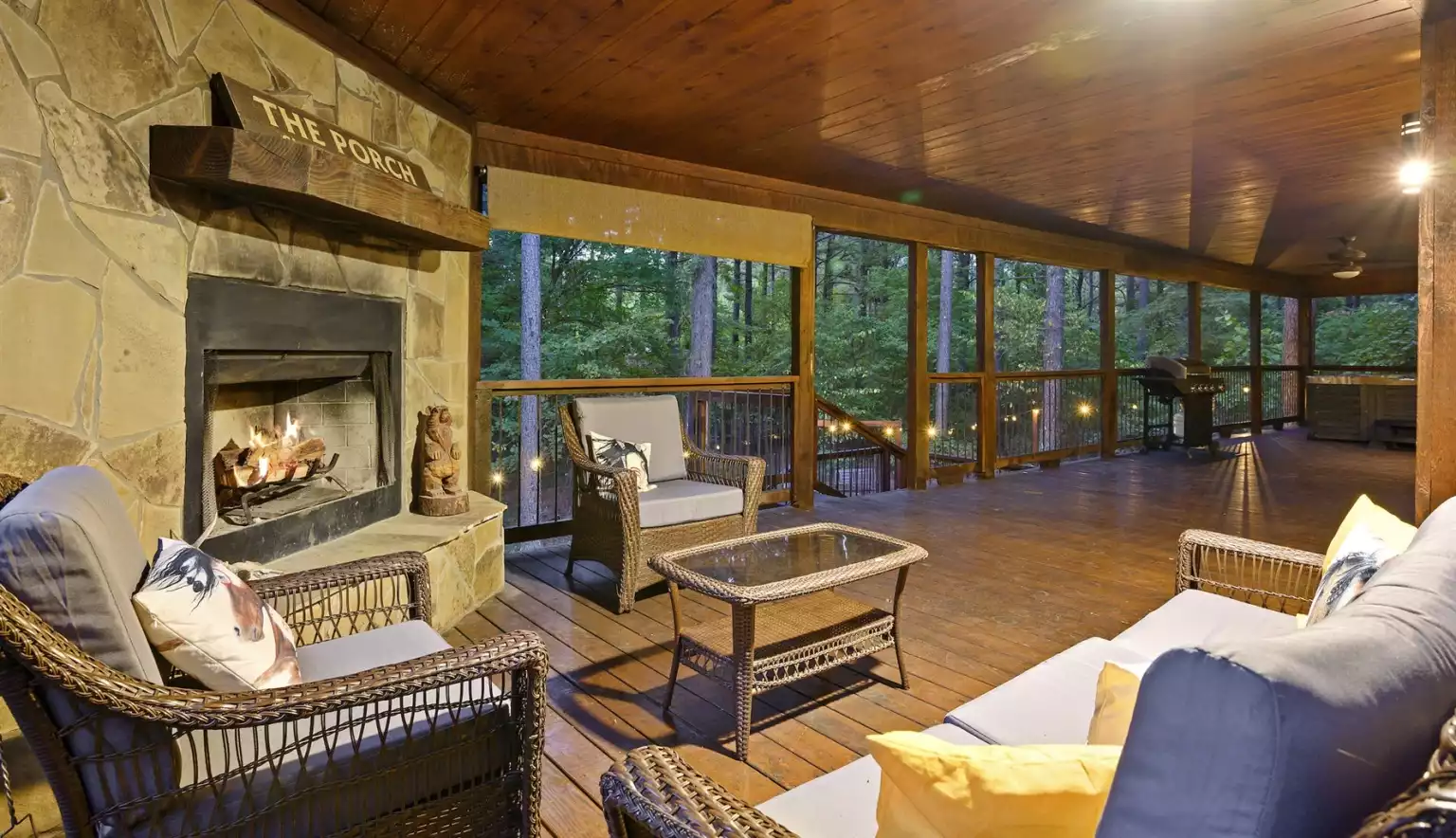 Enjoy the outdoor porch w/ wood fireplace, gas grill and hot tub Enjoy the outdoor porch w/ wood fireplace, gas grill and hot tub - Iron Horse Lodge - Broken Bow