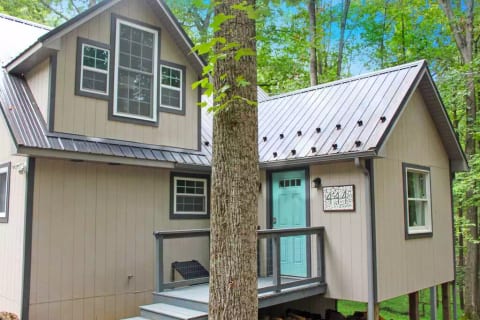 The cabin is nestled down into a private area of the Woods Resort.