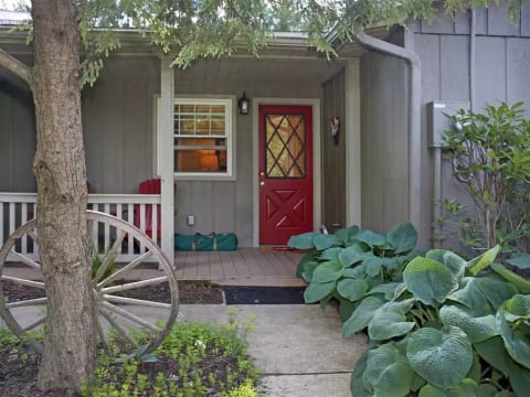Sidewalk leads to front door. Croquet set, Corn Hole, & Tetherball available.