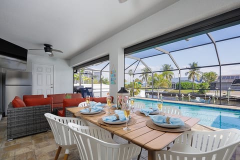Outdoor Lanai with dining seats and outdoor furniture to hang out and watch your favorite shows on a smart TV. Outdoor propane grill included.